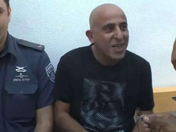 אבי רוחן בהארכת מעצר. ינואר 2014 (צילום מסך , טל אנגלנדר) אבי רוחן בהארכת מעצר. ינואר 2014 (צילום מסך , טל אנגלנדר)