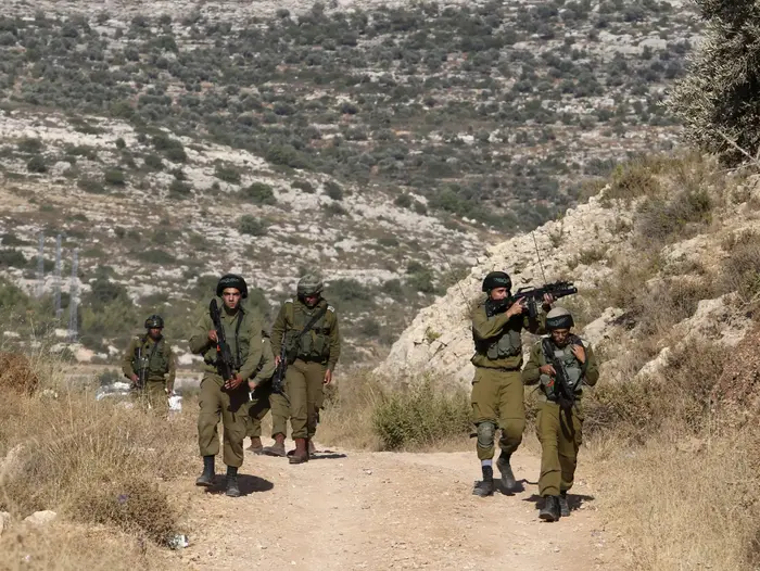 פיגוע ירי בסמוך להתנחלות דולב, 20 ביוני 2015 (AP) פיגוע ירי בסמוך להתנחלות דולב, 20 ביוני 2015 (AP)