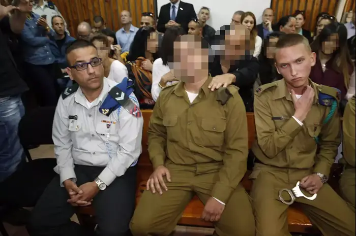 החייל העצור בחשד לרצח מחבל בבית הדין בקסטינה (אתר רשמי , AFP) החייל העצור בחשד לרצח מחבל בבית הדין בקסטינה (אתר רשמי , AFP)