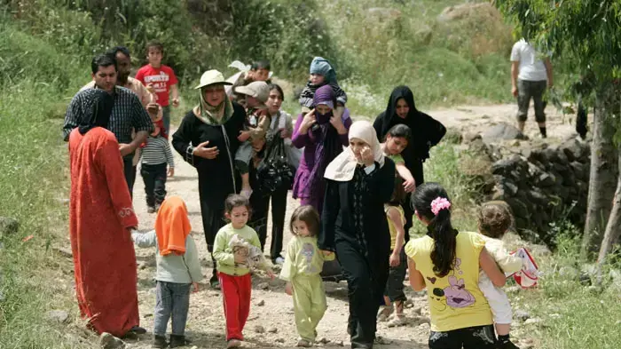 פליטים שנמלטו מרדיפת שלטונות סוריה והגיעו לעיירה ואדי חאלד, לבנון, 16 במאי 2011 פליטים שנמלטו מרדיפת שלטונות סוריה והגיעו לעיירה ואדי חאלד, לבנון, 16 במאי 2011