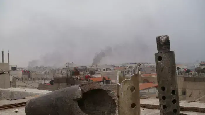 עשן עולה מעל ערבין, פרבר של דמשק, במהלך הלחימה בין צבא סוריה למורדים, 29 בינואר 2012 עשן עולה מעל ערבין, פרבר של דמשק, במהלך הלחימה בין צבא סוריה למורדים, 29 בינואר 2012