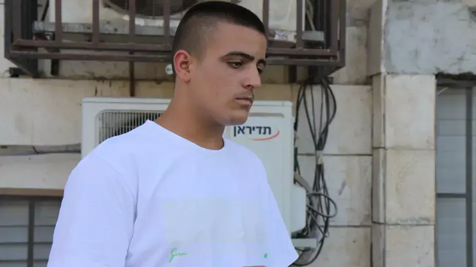 אור פליסיאן אחיו של חגי פליסיאן בבית המשפט. יוני 2013