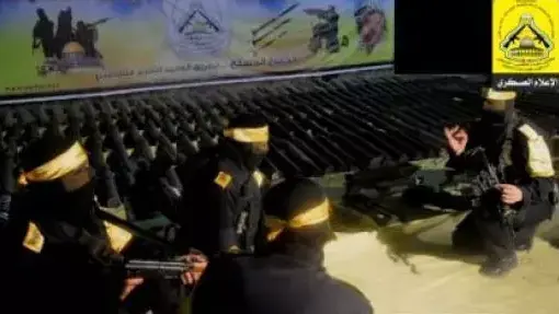 ביום בו נפתח המו"מ, תצוגת תכלית  של כלי נשק ואמצעי לחימה  באתר  גדודי אל-אקצא של הפת"ח, יולי 2013