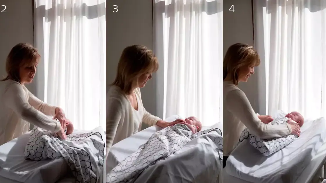 שלבים בעיטוף תינוק בשמיכת עיטוף של swaddle שלבים בעיטוף תינוק בשמיכת עיטוף של swaddle