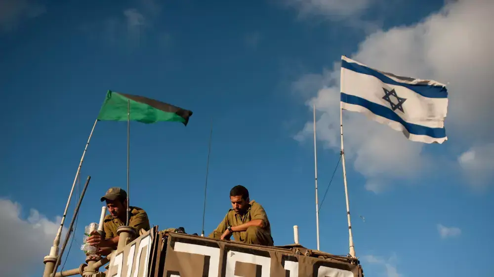 חיילי שריון בכניסה לרצועת עזה במסגרת מבצע "צוק איתן", יולי 2014 חיילי שריון בכניסה לרצועת עזה במסגרת מבצע "צוק איתן", יולי 2014