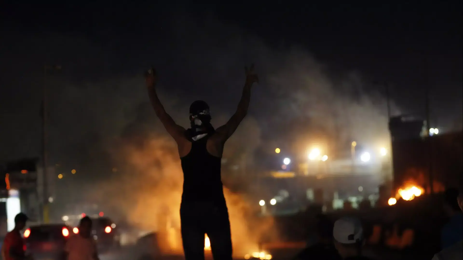מפגין פלסטיני מול מחסום קלנדיה, יולי 2014