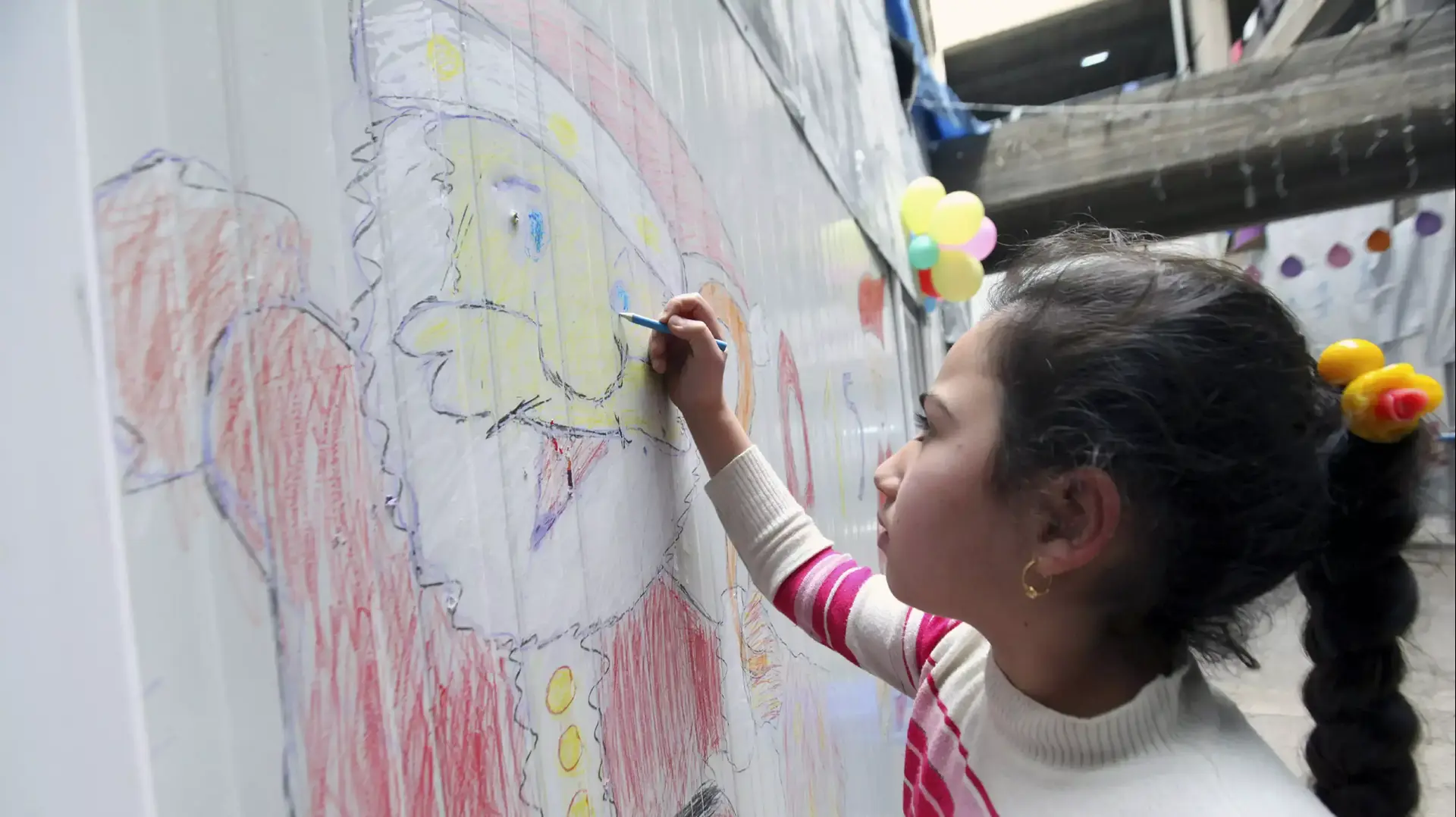 פליטים עיראקיים ממוסול חוגגים את חג המולד במחנה פליטים בארביל