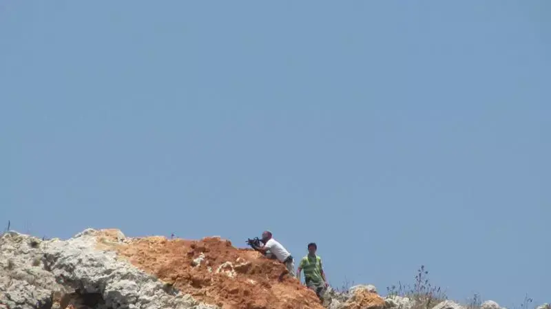 מתנחלים תקפו תושבי פלסטינים תושבי כפר בורין בשנת 2010 והציתו עצי זית