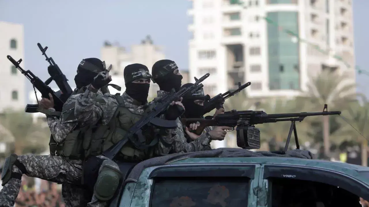 אנשי חמאס רעולי פנים בטקס בעזה, אוגוסט 2015 אנשי חמאס רעולי פנים בטקס בעזה, אוגוסט 2015