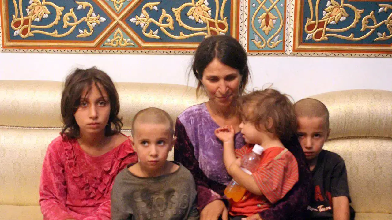אשה דרוזית וילדיה לאחר השחרור משבי דאעש, סווידא, סוריה, אוקטובר 2018