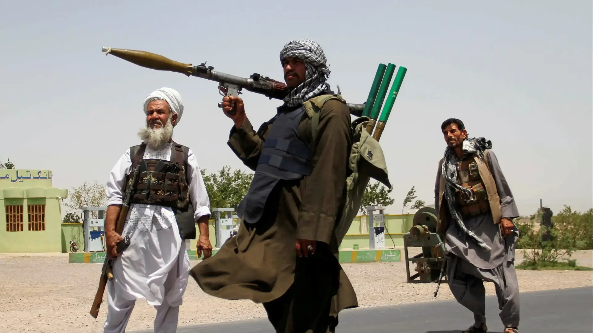 FILE PHOTO: Former Mujahideen hold weapons to support Afghan forces in their fight against Taliban, on the outskirts of Herat province, Afghanistan July 10, 2021. REUTERS/Jalil Ahmad/File Photo
