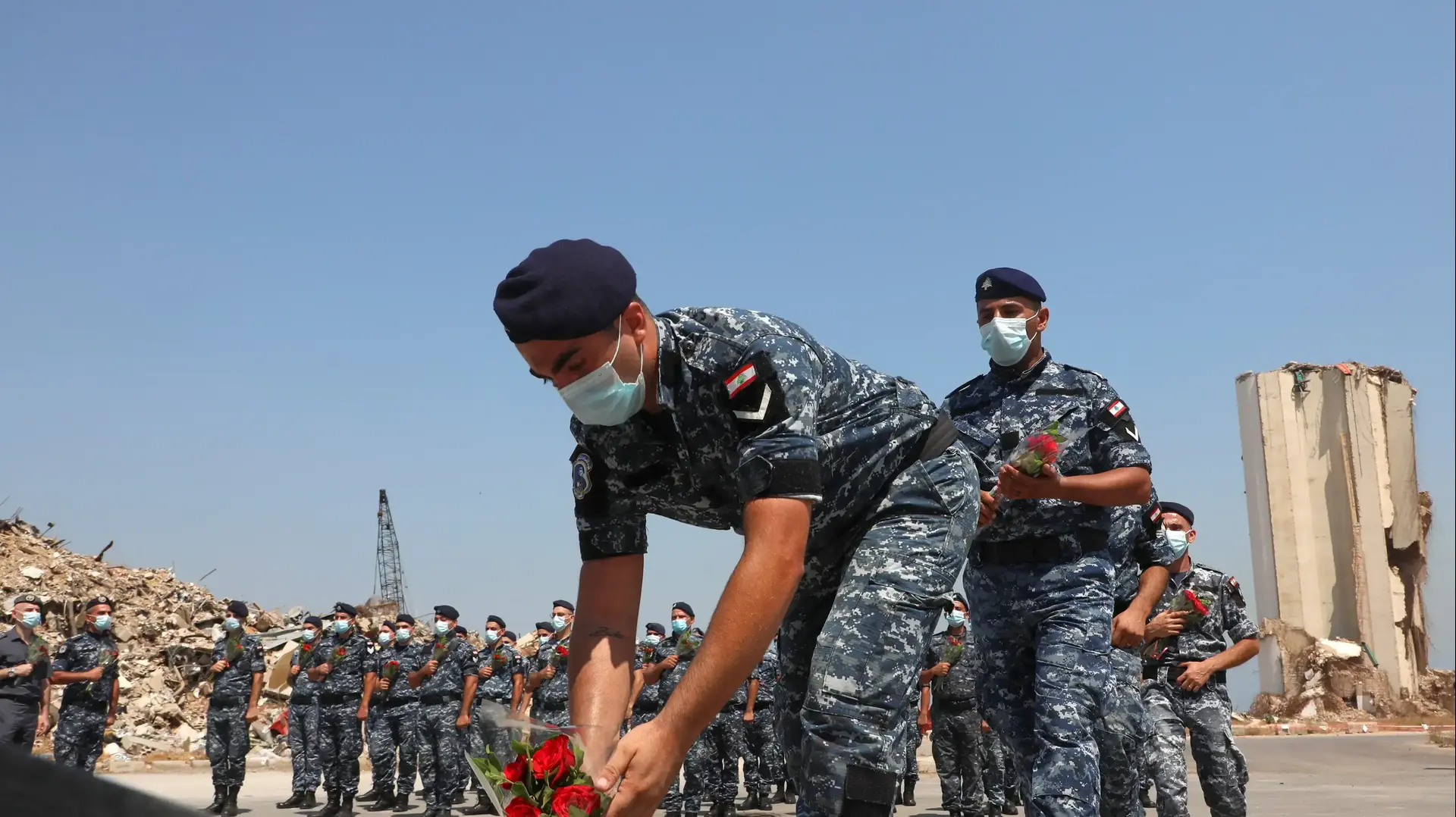 A member of internal security lays flowers as he pays a tribute to the victims of last year's Beirut port, as the country marks one-year anniversary of the port explosion, at Port of Beirut, Lebanon August 4, 2021. REUTERS/Mohamed Azakir
A member of internal security lays flowers as he pays a tribute to the victims of last year's Beirut port, as the country marks one-year anniversary of the port explosion, at Port of Beirut, Lebanon August 4, 2021. REUTERS/Mohamed Azakir