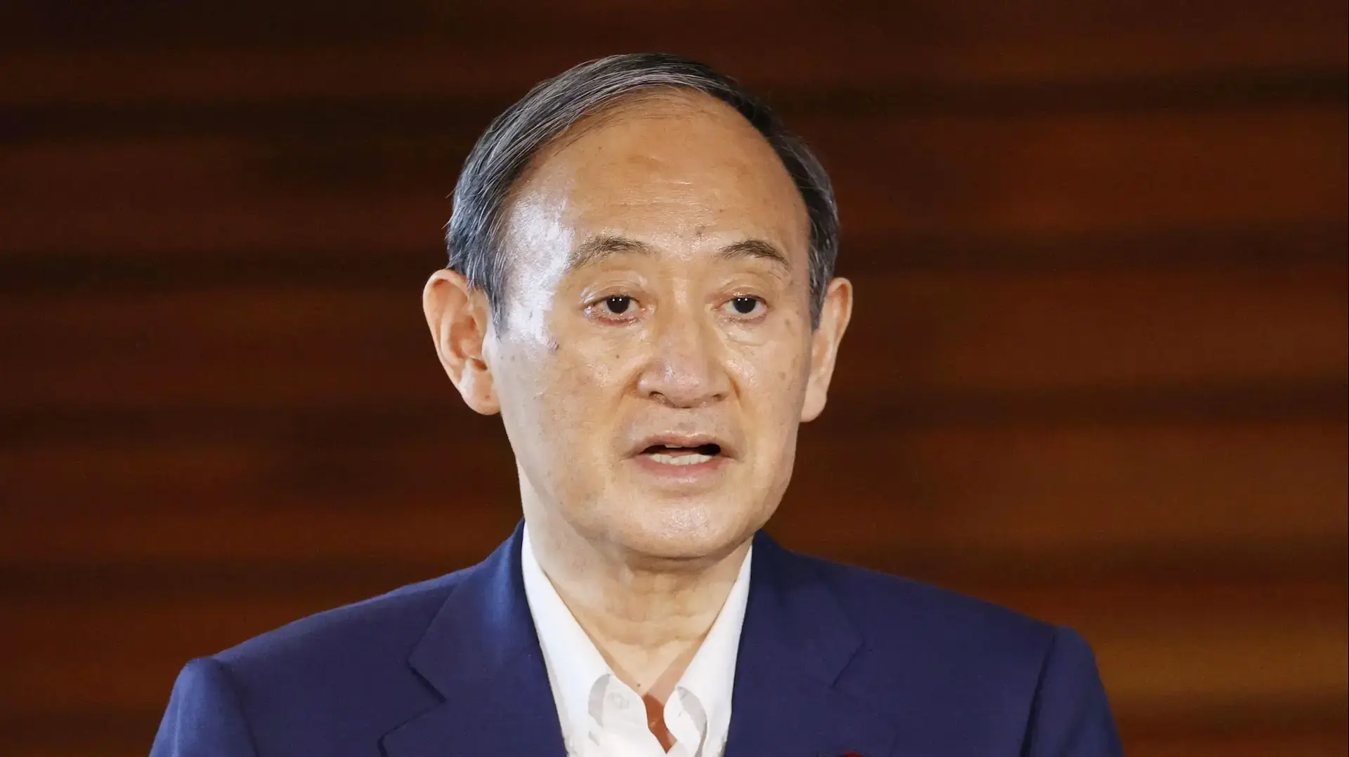 Japan's Prime Minister Yoshihide Suga speaks to media after he annouced to pull out of a party leadership race at his official residence in Tokyo, Japan, September 3, 2021. Kyodo/via REUTERS ATTENTION EDITORS - THIS IMAGE WAS PROVIDED BY A THIRD PARTY. MANDATORY CREDIT. JAPAN OUT. NO COMMERCIAL OR EDITORIAL SALES IN JAPAN. THIS IMAGE WAS PROCESSED BY REUTERS TO ENHANCE QUALITY, AN UNPROCESSED VERSION HAS BEEN PROVIDED SEPARATELY.