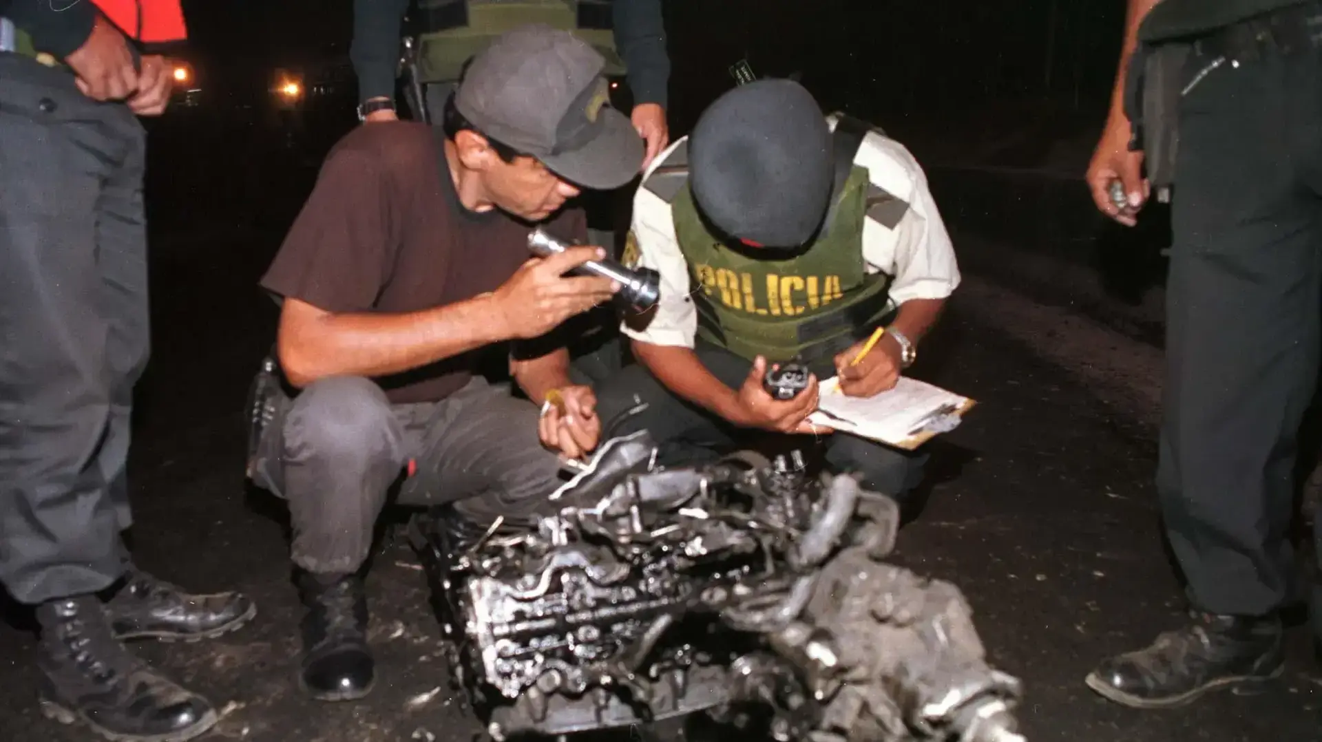 Police inspect the engine of a van which flew 100 meters after Maoist Shining Path guerillas detonated a car bomb outside a police station in Lima, May 15. The guerillas, who had earlier promised to turn this month into "Bloody May," fought with police qand then set off 88 pounds (40 kgs) of dynamite from a van that pulled up in front of the station. At least eight officers were wounded. It was the highest profile attack in Peru since the bloody end to the four-month hostage crisis provoked by Police inspect the engine of a van which flew 100 meters after Maoist Shining Path guerillas detonated a car bomb outside a police station in Lima, May 15. The guerillas, who had earlier promised to turn this month into "Bloody May," fought with police qand then set off 88 pounds (40 kgs) of dynamite from a van that pulled up in front of the station. At least eight officers were wounded. It was the highest profile attack in Peru since the bloody end to the four-month hostage crisis provoked by