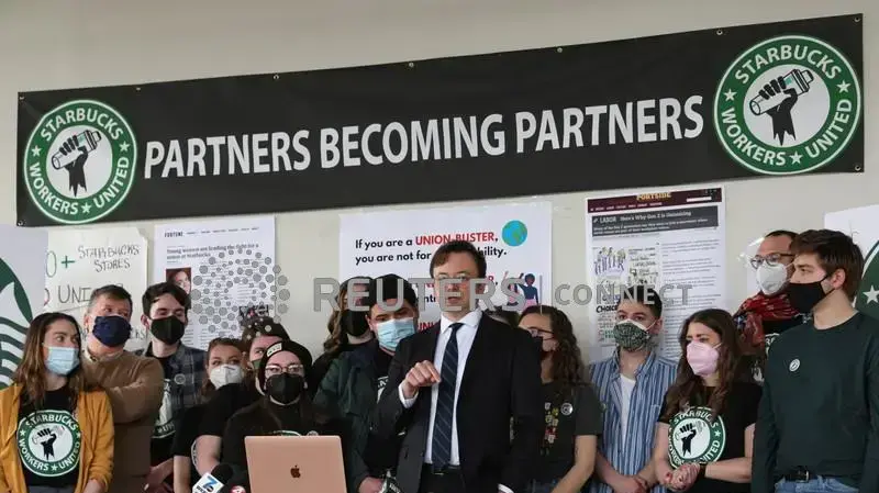 Attorney Ian Hayes and Starbucks workers speak during a news conference to react to a decision by the National Labor Relations Board to postpone a scheduled union vote count in Buffalo, New York, U.S., February 23, 2022. REUTERS/Brendan McDermid