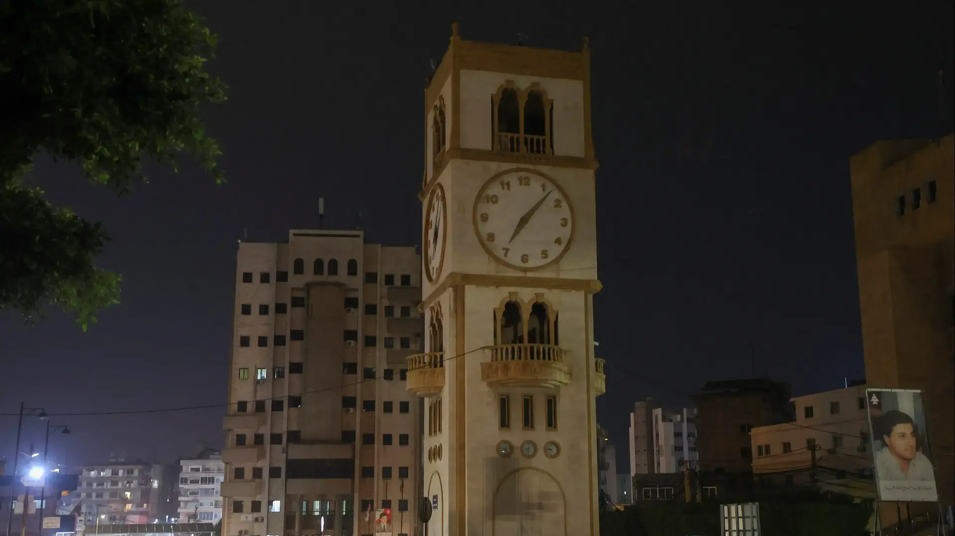 A car drives near a clock tower in Jdeideh, Lebanon March 25, 2023. REUTERS/Mohamed Azakir
