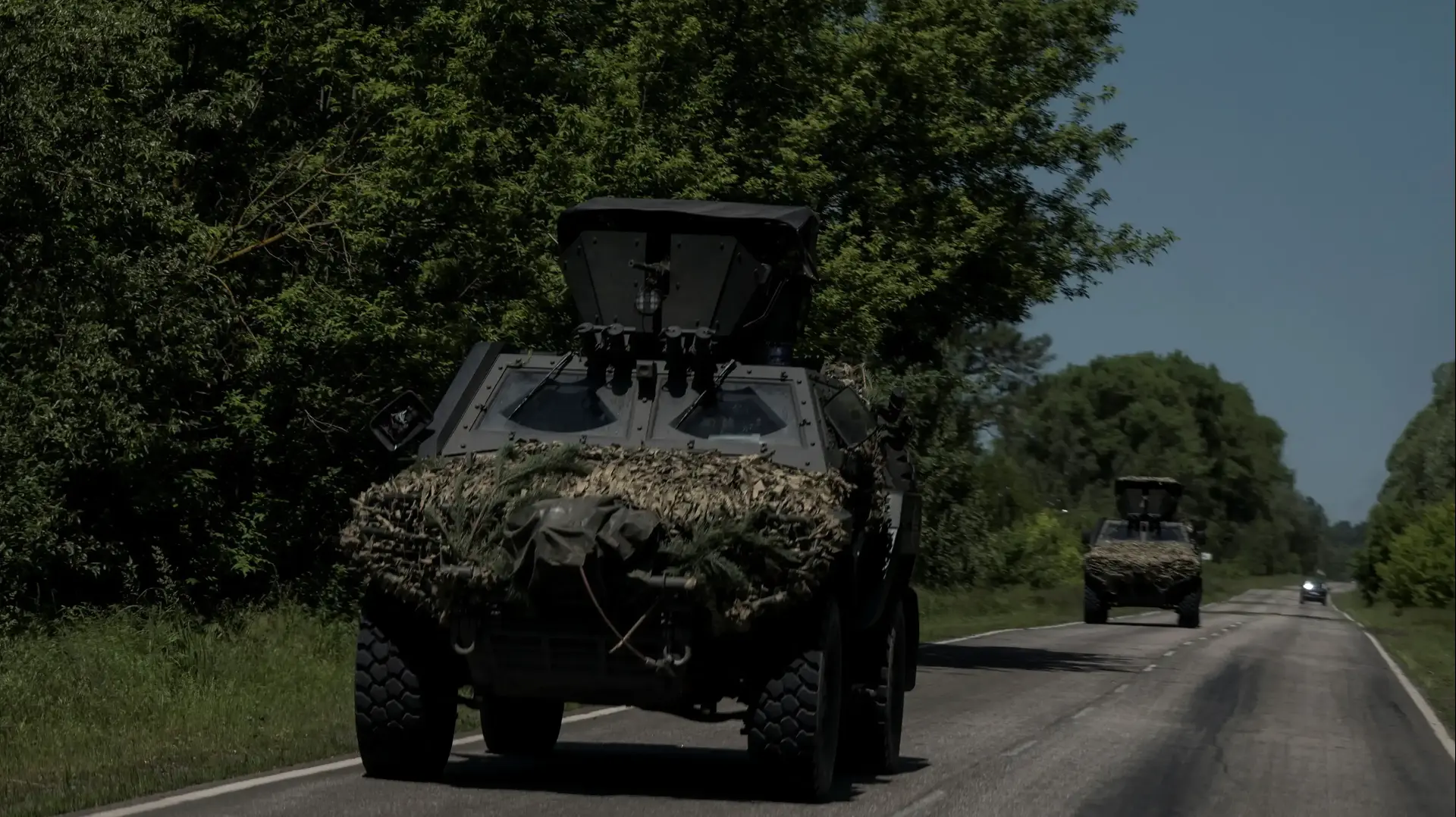 Armored vehicles are seen along a road near the Ukraine-Russia border, amid Russia's attack on Ukraine, in Kharkiv region, Ukraine, June 4, 2023. REUTERS/Viacheslav Ratynskyi

