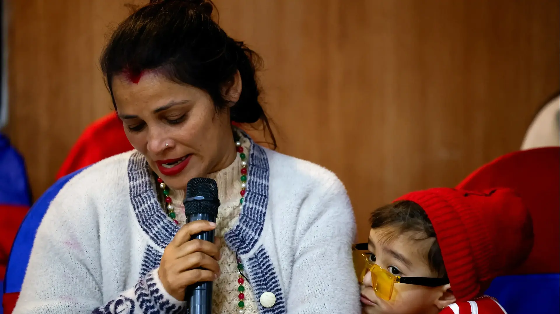 Tina Ghimire, wife of Padam Ghimire, speaks to members of the media about her husband, who is in Russia, as families of Nepali nationals who have been recruited by the Russian army to fight against Ukraine pleaded for their safe return, in Kathmandu, Nepal February 2, 2024. REUTERS/Navesh Chitrakar
