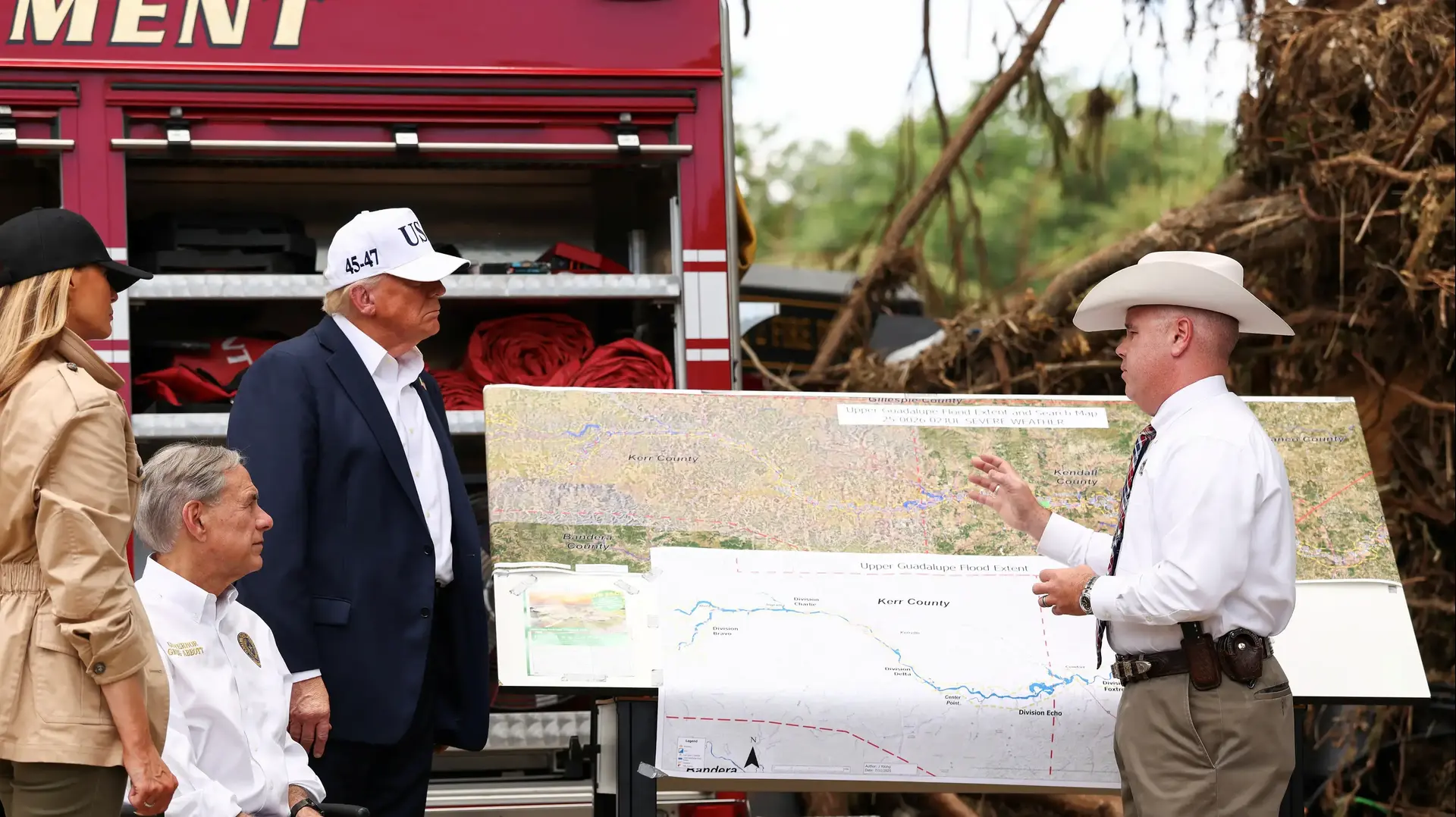 U.S. President Donald Trump, first lady Melania Trump and Texas Governor Greg Abbott receive a briefing from a first responder, as they visit a scene of devastation along the banks of the Guadalupe River, after catastrophic floods, in Kerr County, Texas, U.S., July 11, 2025. REUTERS/Kevin Lamarque
U.S. President Donald Trump, first lady Melania Trump and Texas Governor Greg Abbott receive a briefing from a first responder, as they visit a scene of devastation along the banks of the Guadalupe River, after catastrophic floods, in Kerr County, Texas, U.S., July 11, 2025. REUTERS/Kevin Lamarque