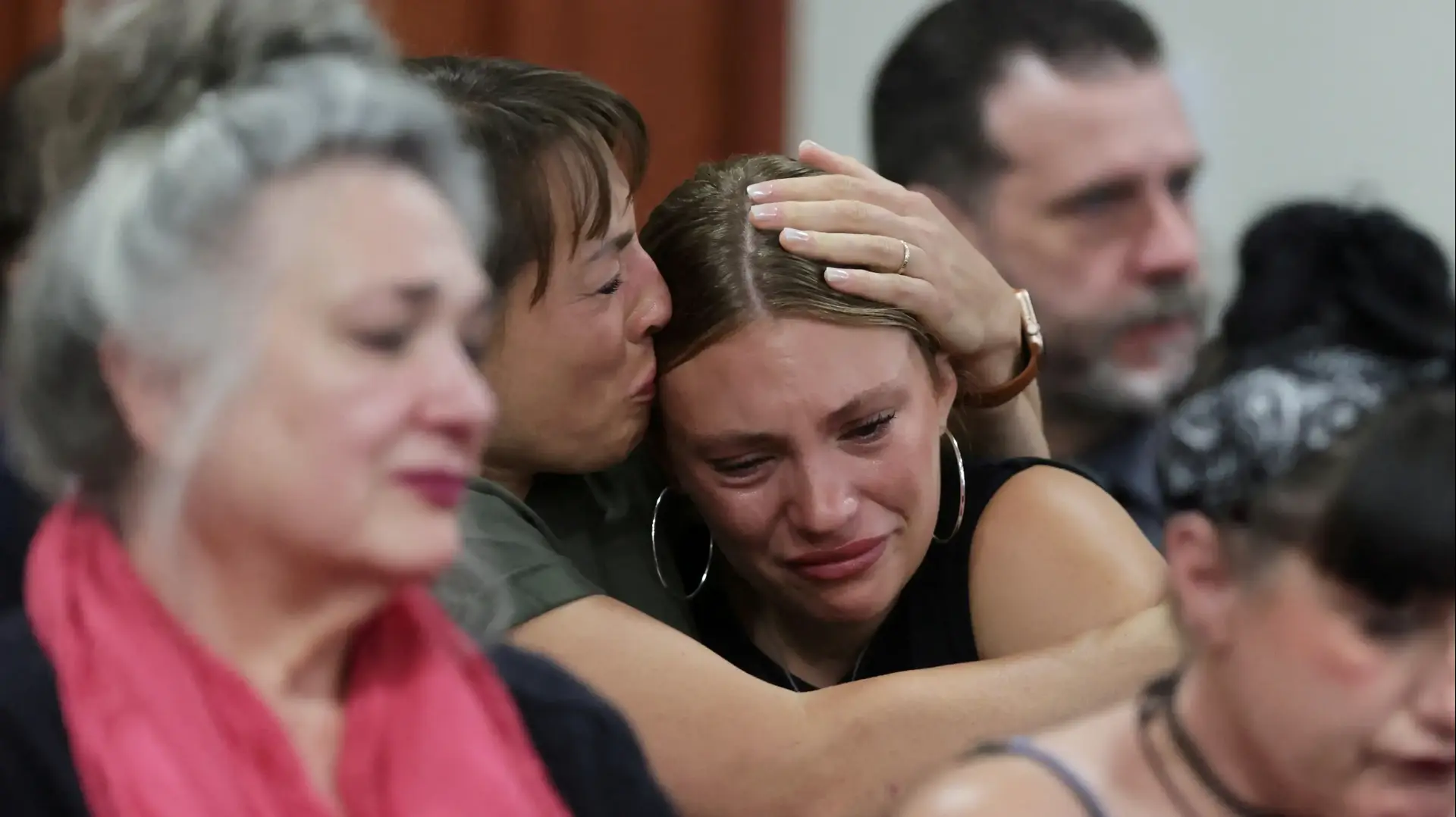 Dylan Mortensen gets a hug after speaking at the sentencing hearing of Bryan Kohberger after he was convicted in the 2022 stabbing deaths of four Idaho college students, at the Ada County Courthouse, in Boise, Idaho, U.S., July 23, 2025. Kyle Green/Pool via REUTERS TPX IMAGES OF THE DAY
Dylan Mortensen gets a hug after speaking at the sentencing hearing of Bryan Kohberger after he was convicted in the 2022 stabbing deaths of four Idaho college students, at the Ada County Courthouse, in Boise, Idaho, U.S., July 23, 2025. Kyle Green/Pool via REUTERS TPX IMAGES OF THE DAY