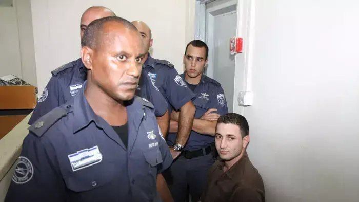 הנאשם ברצח משפחת פוגל, אמג'ד עוואד, בבית המשפט היום, אוקטובר 2011 הנאשם ברצח משפחת פוגל, אמג'ד עוואד, בבית המשפט היום, אוקטובר 2011
