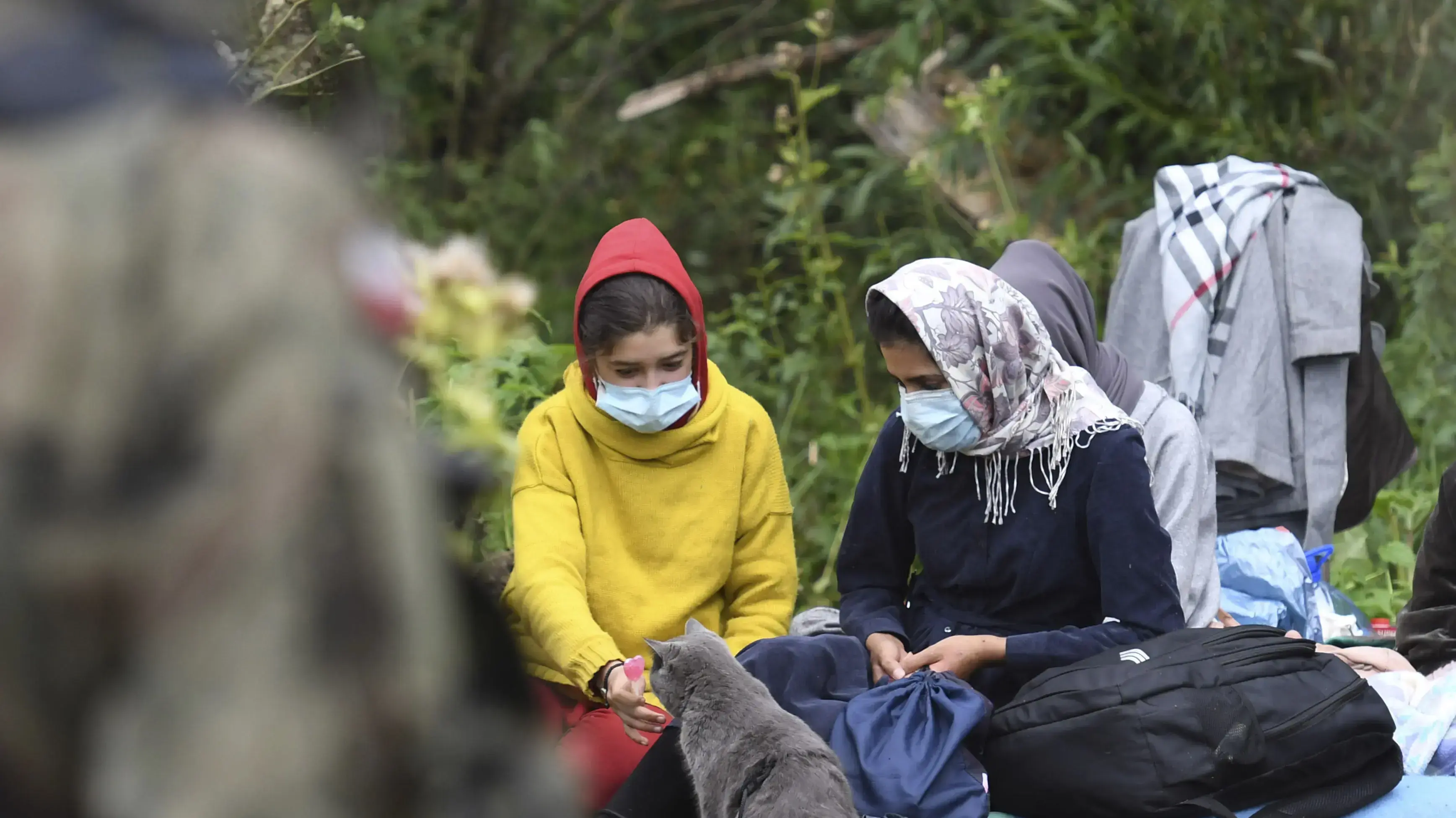 Migrants wait in an area between the
ששגשגש
 borders of Belarus and Poland near the village of Usnarz Gorny, Poland, on Friday Aug. 20, 2021. A refugee rights group in Poland said Friday that 32 people who fled Afghanistan have been trapped for 12 days in an area between the Polish and Belarusian borders, caught up in a standoff between the two countries. (AP Photo/Michal Kosc)