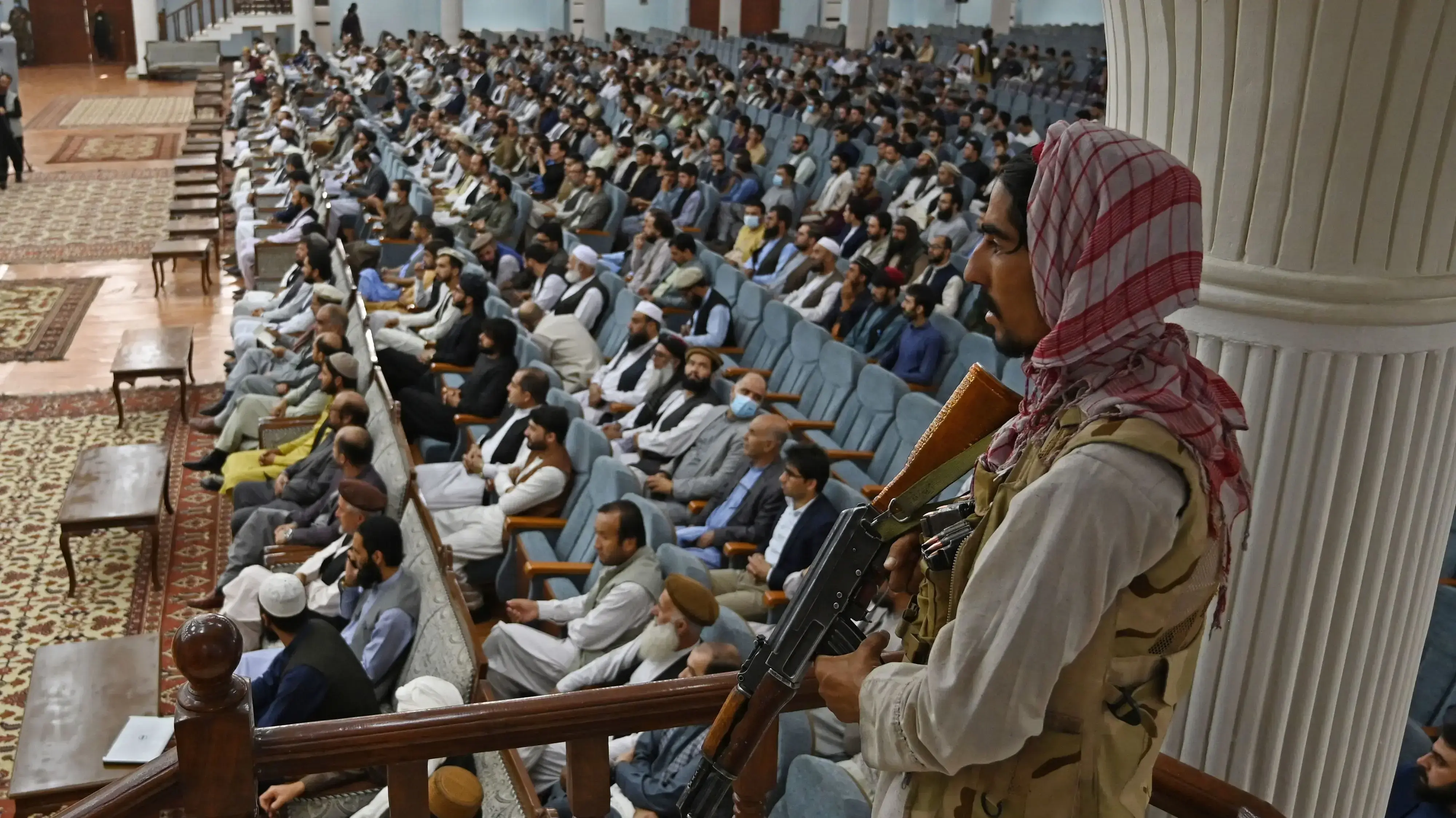 TOPSHOT - A Taliban fighter stands guard as Talibans acting Higher Education Minister Abdul Baqi Haqqani (not pictured) addresses a gathering during a consultative meeting on Taliban's general higher education policies at the Loya Jirga Hall in Kabul on August 29, 2021. - Afghan women will be allowed to study at university but there would be a ban on mixed classes under their rule, Haqqani said. (Photo by Aamir QURESHI / AFP) (Photo by AAMIR QURESHI/AFP via Getty Images)
TOPSHOT - A Taliban fighter stands guard as Talibans acting Higher Education Minister Abdul Baqi Haqqani (not pictured) addresses a gathering during a consultative meeting on Taliban's general higher education policies at the Loya Jirga Hall in Kabul on August 29, 2021. - Afghan women will be allowed to study at university but there would be a ban on mixed classes under their rule, Haqqani said. (Photo by Aamir QURESHI / AFP) (Photo by AAMIR QURESHI/AFP via Getty Images)
