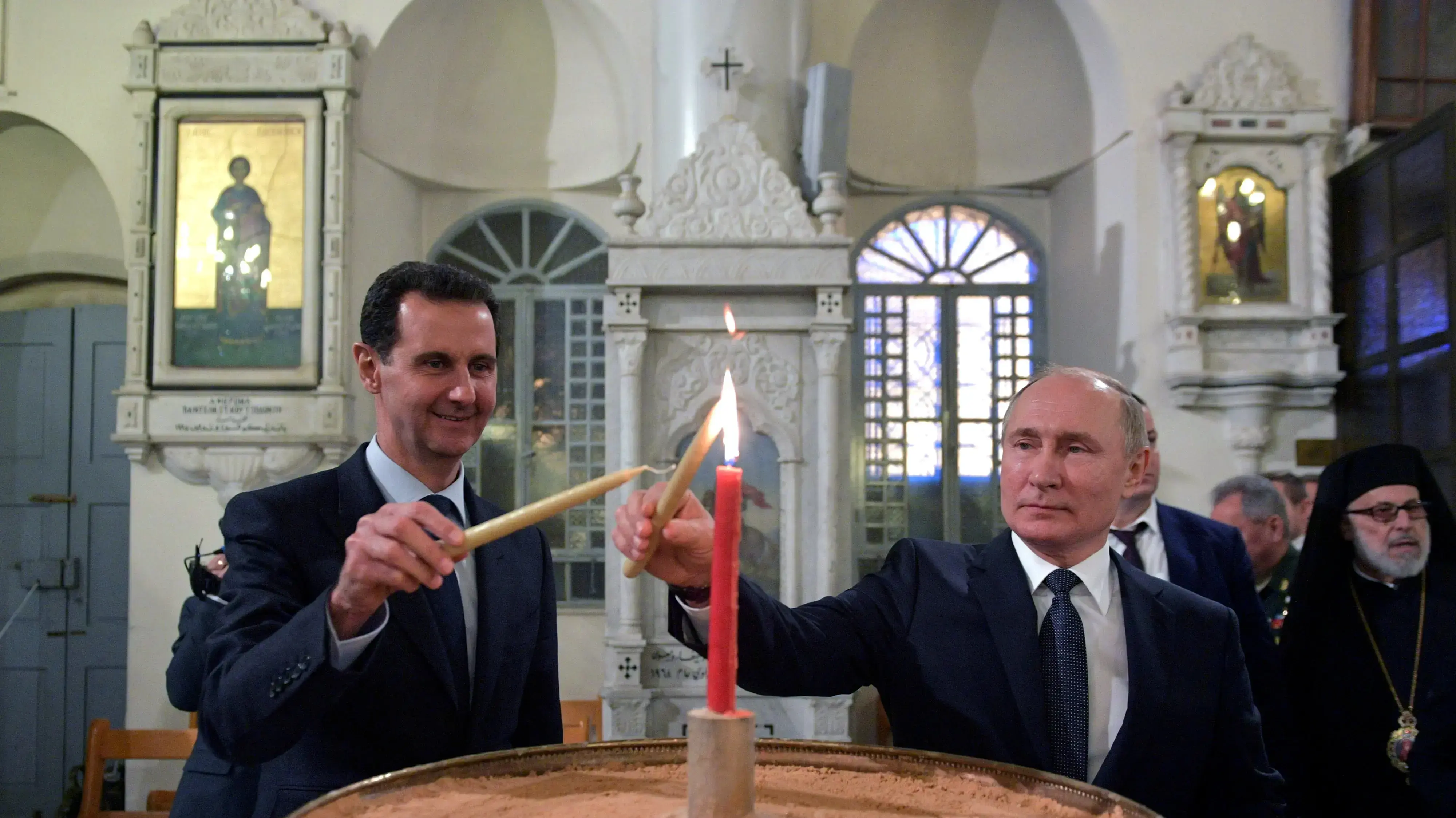 נשיא סוריה בשאר אסד ונשיא רוסיה ולדימיר פוטין בביקור בכנסייה אורתודוכסית בדמשק, 7 בינואר 2020 נשיא סוריה בשאר אסד ונשיא רוסיה ולדימיר פוטין בביקור בכנסייה אורתודוכסית בדמשק, 7 בינואר 2020