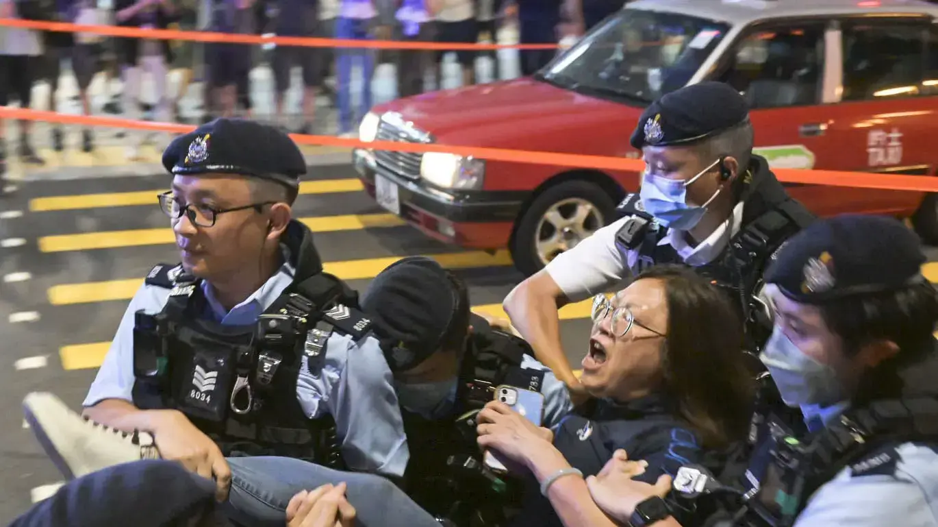A woman is taken away by authorities in Causeway Bay district in Hong Kong on June 4, 2023, for mourning the victims of China's 1989 Tiananmen Square crackdown on the 34th anniversary of the incident. (Kyodo) ==Kyodo NO USE JAPAN
A woman is taken away by authorities in Causeway Bay district in Hong Kong on June 4, 2023, for mourning the victims of China's 1989 Tiananmen Square crackdown on the 34th anniversary of the incident. (Kyodo) ==Kyodo NO USE JAPAN