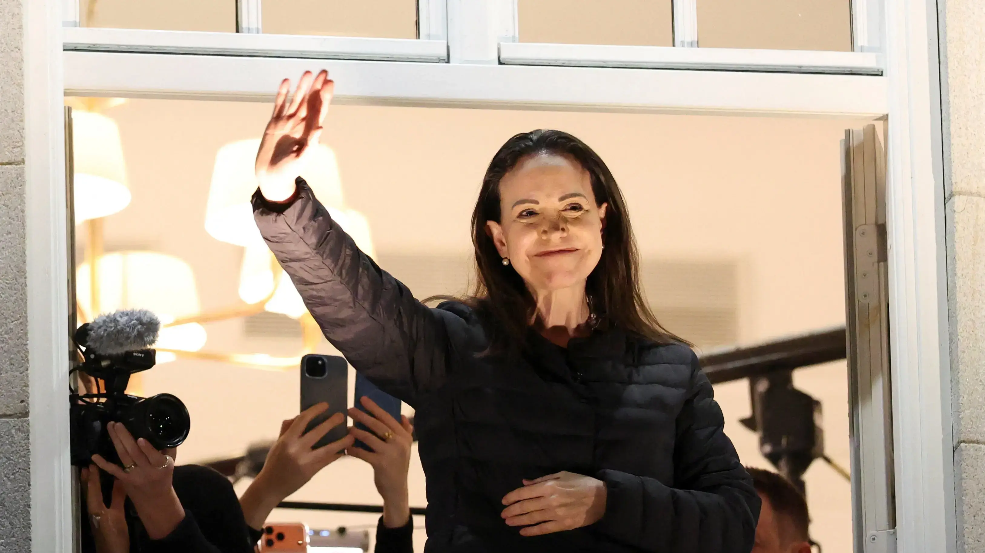 Nobel Peace Prize laureate Maria Corina Machado waves from a balcony of Grand Hotel, after her daughter Ana Corina Sosa Machado, accepted the award on her behalf, in Oslo, Norway December 11, 2025. Nobel Peace Prize laureate Maria Corina Machado waves from a balcony of Grand Hotel, after her daughter Ana Corina Sosa Machado, accepted the award on her behalf, in Oslo, Norway December 11, 2025.