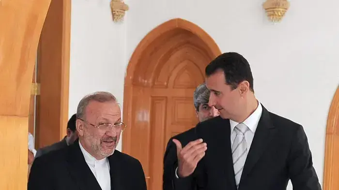 בשאר אסד ושר החוץ האירני מנושהר מותקי. בשאר אסד ושר החוץ האירני מנושהר מותקי.